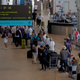 People wait in queues at Faro airport amid the coronavirus disease (COVID-19) pandemic, in Faro